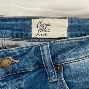 Size 30 lightly distressed straight leg jean.